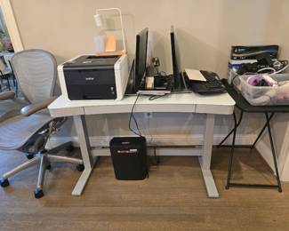 adjustable height desk, desk chair, printer, monitors, keyboards, paper shredder and more