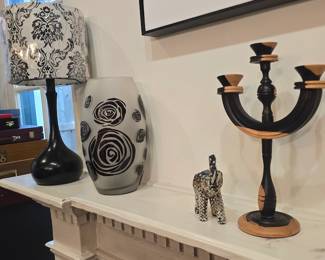 We have a pair of small black & white lamps, wooden candlestick and lots of home decor
