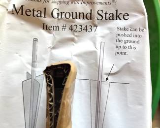 6 Metal Ground Stakes Set of (6) black metal ground stakes, item #423437 by Improvements. Heavy-duty steel stakes designed for securing outdoor décor, landscape items, signs, or garden accessories into the ground.  Appear unused/new old stock with original paperwork included. Simple push-in design with stabilizing fins for secure placement. See photos for details and condition. 