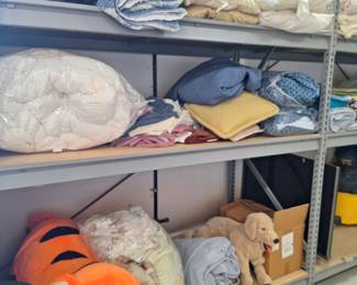 Blankets, sheets, and stuffed tiger