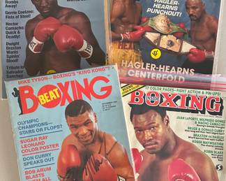 Vintage boxing magazines, along with Mike Tyson autograph