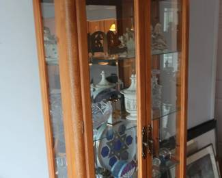 Curio cabinet 32" wide x 11 1/2" deep Price is 150.00 Decor items are separate.