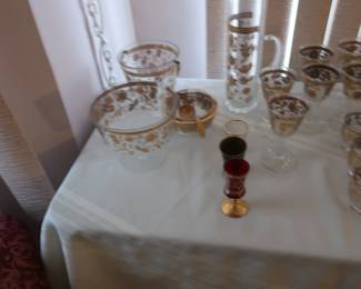 gold trimmed stemware, glasses, pitcher, bowls