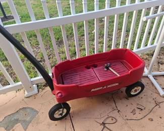 Kids playing radio flyer wagon $20( storage under seat)