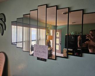 Measurements for 80's black leather couch ( Miami vice style) , shown in other photo. The mirror is $125