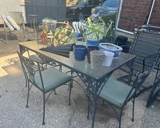 Glass topped wrought iron outdoor table and 4 chairs