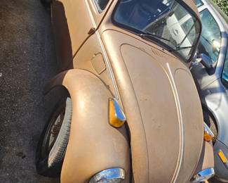 1976 VW Beetle With Title, NO ENGINE, Parts missing. Sold AS IS, Roller Chassis with Title. Needs rear quarter panel metal work or turn into yard art.  $1500