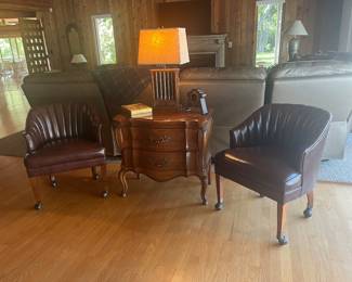 Leather Barrel-Back Club Chairs on Rollers, Bombe Table