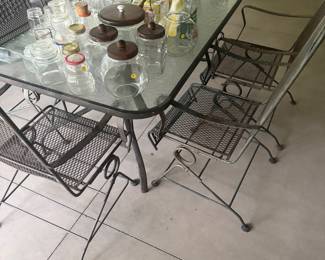 Metal patio table and six chairs