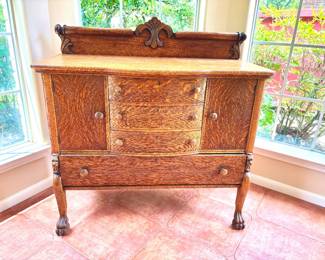 Outstanding antique tiger oak sideboard with claw feet