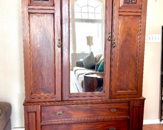 Stately antique wardrobe with mirror