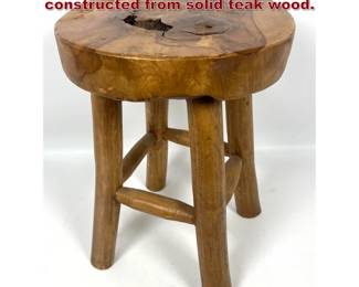 Lot 173 Rustic fourlegged stool is constructed from solid teak wood. 