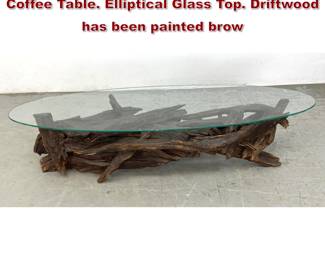 Lot 269 Assembled Natural Driftwood Base Coffee Table. Elliptical Glass Top. Driftwood has been painted brow