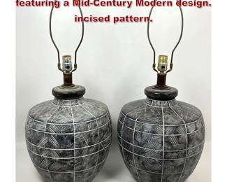 Lot 563 Pair largescale ceramic table lamps featuring a MidCentury Modern design. incised pattern. 
