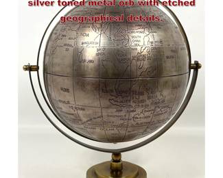Lot 111 Decorative table globe featuring a silver toned metal orb with etched geographical details.