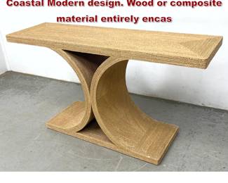 Lot 301 Sculptural console table features a Coastal Modern design. Wood or composite material entirely encas