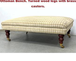 Lot 343 Large Oversized Upholstered Ottoman Bench. Turned wood legs with brass casters. 
