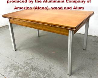 Lot 349 Kensington drawleaf dining table produced by the Aluminum Company of America Alcoa. wood and Alum