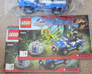 Lot # B187 - LEGO Jurassic World 75916 Raptor Chase Blue Jeep Set with Minifigure & Dinosaur Toy