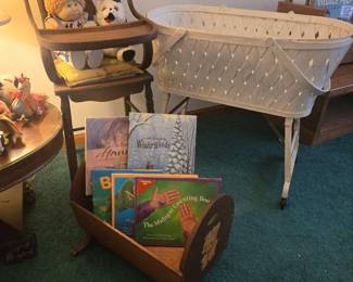 Antique high chair, antique bassinet, children's books