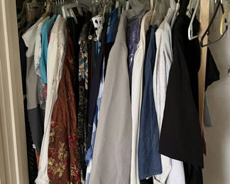 Lot 95: Assorted women's clothing on a clothes rack