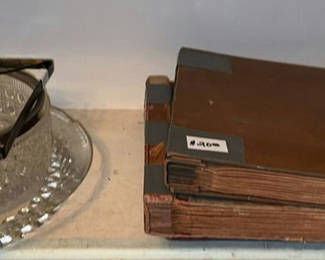 Lot 42: Vintage glass serving dish with ornate metal frame and antique vinyl records