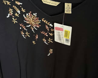 Lot 333: Wedding dress and assorted clothing on a garment rack