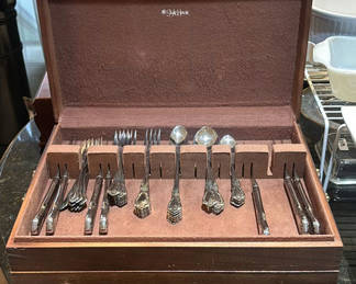Lot 248: Ornate silverware set in a two-tier wooden storage case