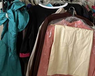 Lot 334: Assorted women's dresses and jackets on a garment rack
