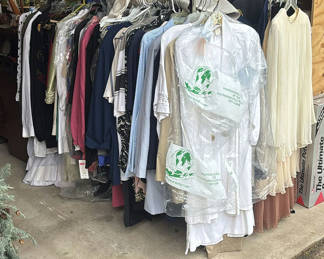 Lot 280: Assorted women's clothing on a rack