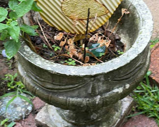 Lot 30: Overgrown planters and containers in a yard