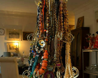 Lot 36: Beaded necklaces on a necklace display tree