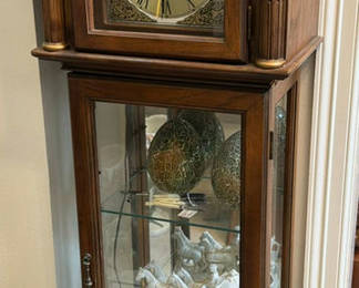 Lot 327: Grandfather clock with display cabinet, crackle-glazed eggs, and porcelain carriage