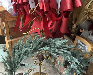 Lot 235: Assorted Christmas Decorations: wreath, brass centerpiece, and figurines