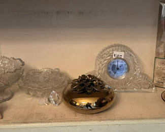 Lot 40: Crystal glass bowls, clock, and brass decorative items