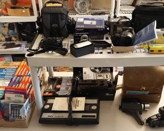 Intellivision, camcorders, Cannon Powershot G12, Sony cameras, Bell & Howell Director series movie camera, GAF movie projector