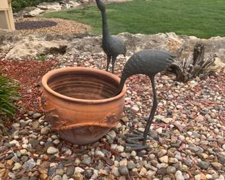 Large garden pot, brass stork sculptures