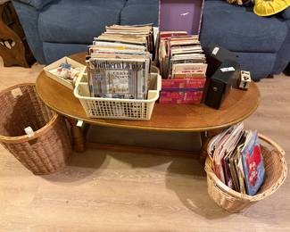 Coffee table, wastebaskets, books, and more in living room
