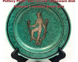 Lot 799 Swedish GUSTAVSBERG Argenta Pottery Plate. The circular stoneware dish features a mottled green glaz
