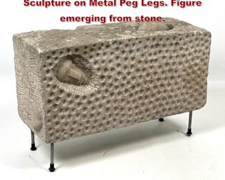 Lot 780 Modernist Solid Limestone Block Sculpture on Metal Peg Legs. Figure emerging from stone. 