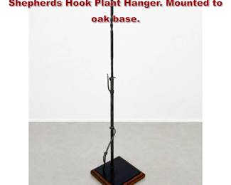 Lot 683 Arts and Crafts Style Forged Iron Shepherds Hook Plant Hanger. Mounted to oak base. 
