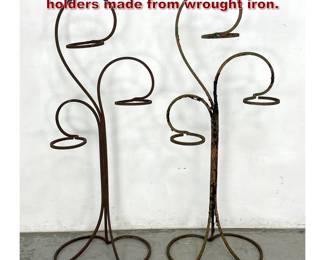 Lot 962 Pair of multitier floorstanding plant holders made from wrought iron.