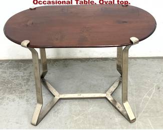Lot 927 Art Deco Style Steel and Wood Occasional Table. Oval top. 