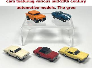 Lot 1572 5 vintage HO scale electric slot cars featuring various mid20th century automotive models. The grou