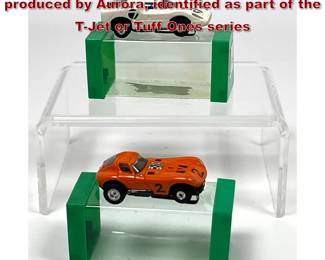 Lot 1589 2 Vintage HO scale slot cars produced by Aurora, identified as part of the TJet or Tuff Ones series