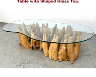 Lot 1249 Decorator Cyprus Root Coffee Table with Shaped Glass Top. 