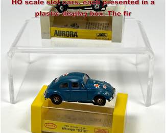 Lot 1593 2 vintage Aurora Model Motoring HO scale slot cars, each presented in a plastic display box. The fir