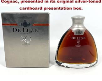 Lot 1631 De Luze XO Fine Champagne Cognac, presented in its original silvertoned cardboard presentation box.