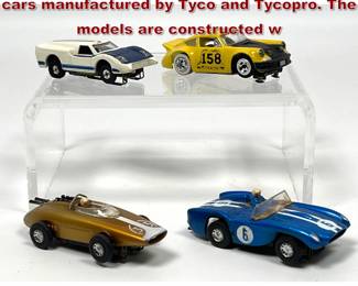 Lot 1569 4 vintage HOscale electric slot cars manufactured by Tyco and Tycopro. The models are constructed w