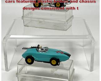 Lot 1597 2 vintage HO scale electric slot cars featuring plastic bodies and chassis designs consistent with t